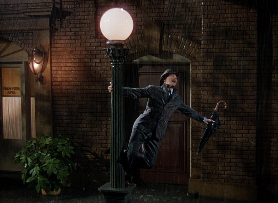 Gene Kelly dancing on a lightpost in the rain.