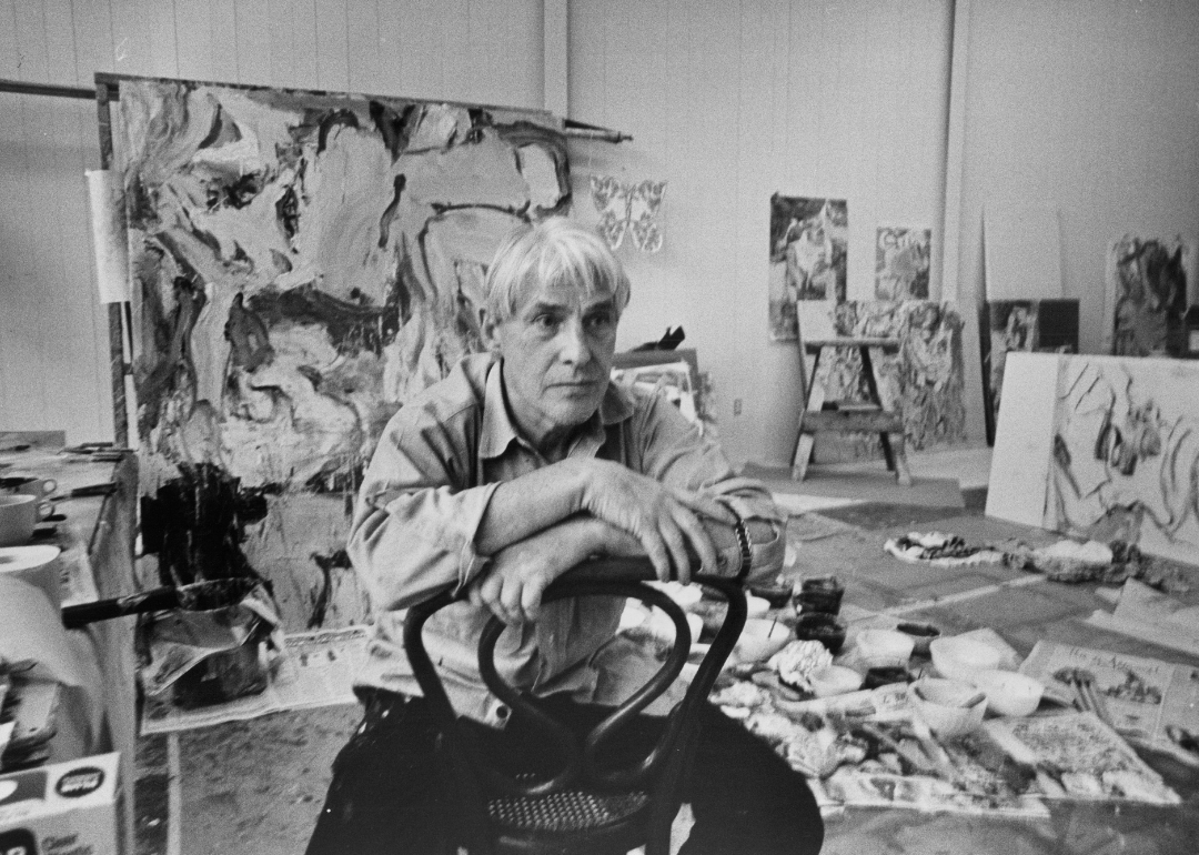 Willem de Kooning photographed in his studio.