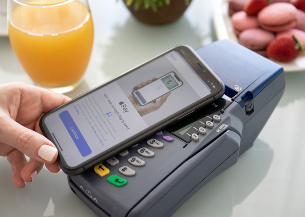 Phone with Apple Pay app making transaction