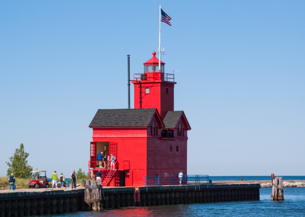 People touring historic big red lighthouse