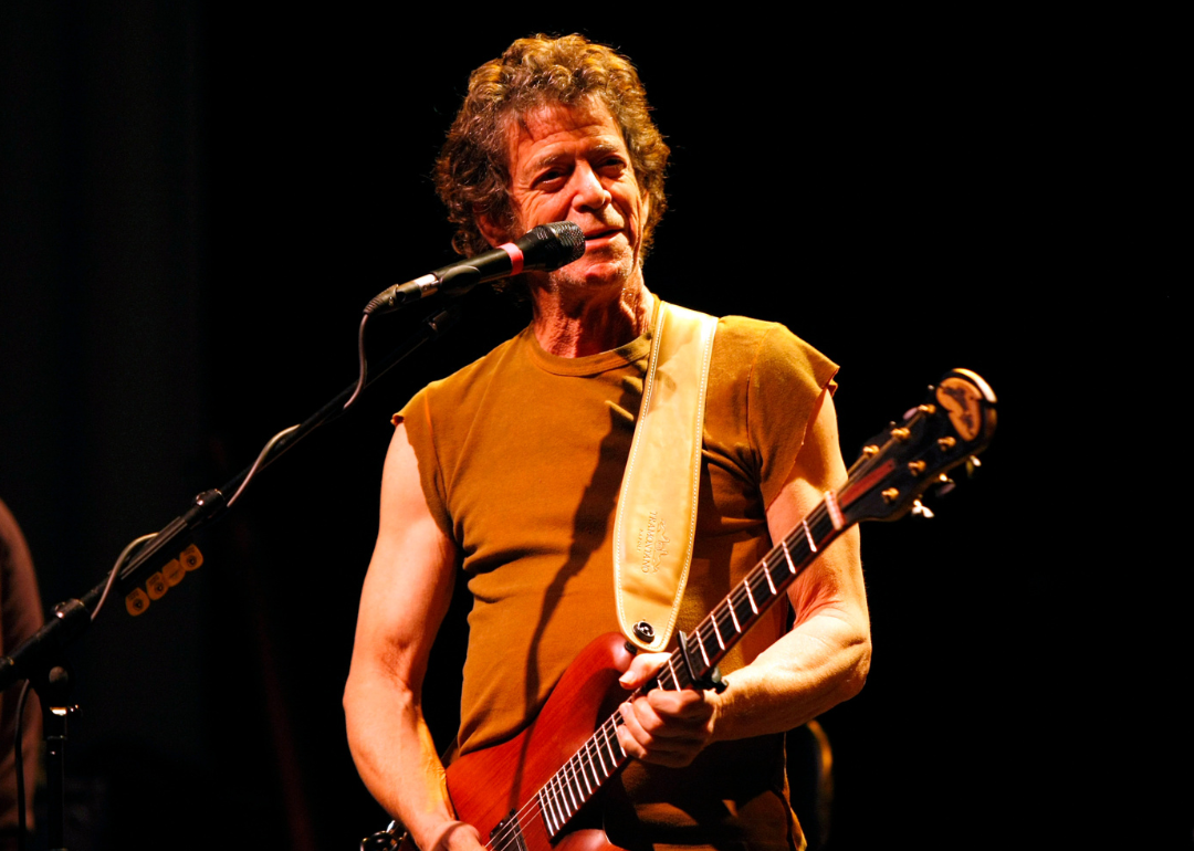 Lou Reed performs onstage.