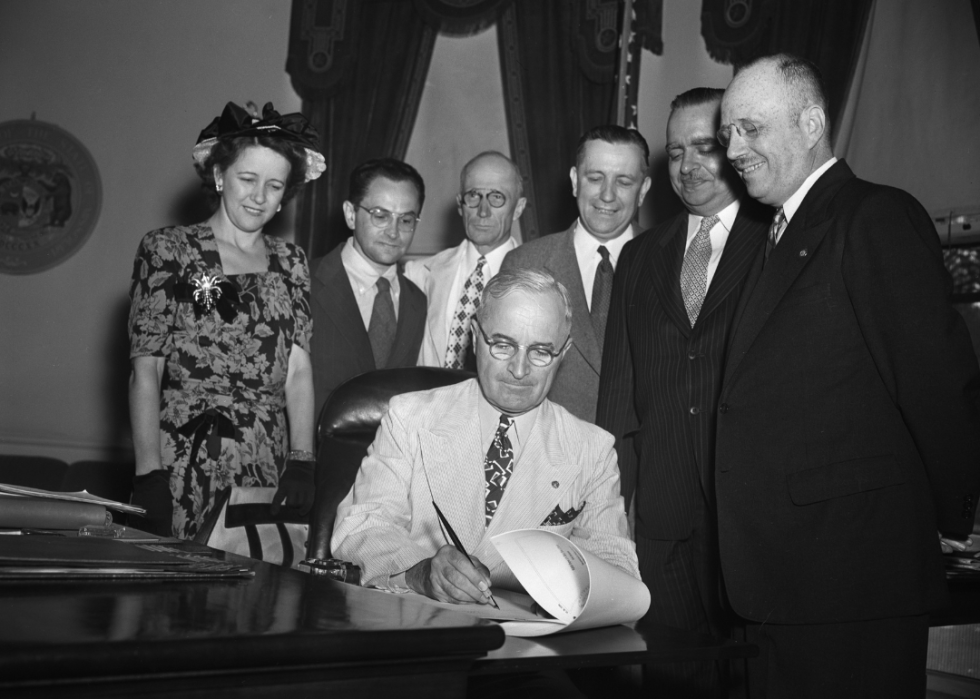 President Truman signs Governor bill