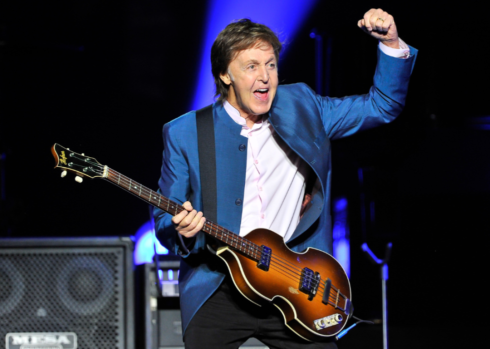 Paul McCartney performing on stage