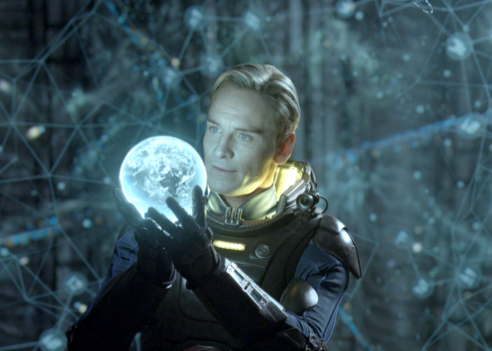 Michael Fassbender holds a glowing orb in a scene from ‘Prometheus’