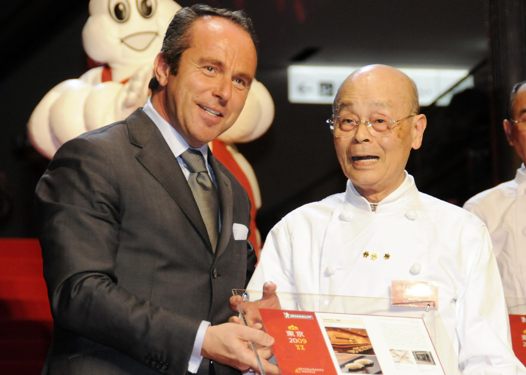 Michelin director Jean-Luc Naret introduces chef Jiro Ono at event.