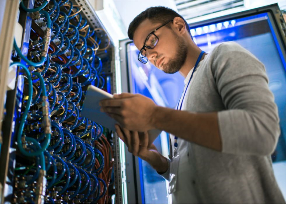 A man in a computer server room.