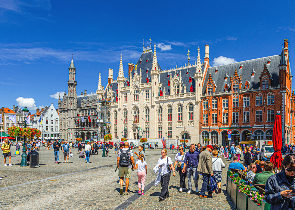 Tourists walking down Market square in Bruges.