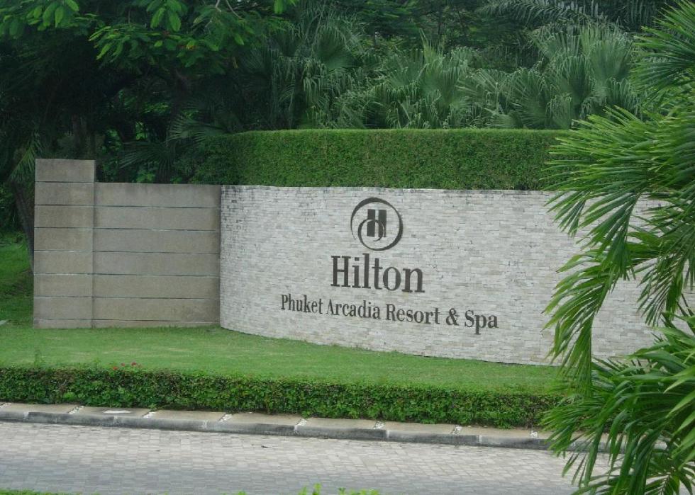Entrance sign bearing Hilton Hotels & Resort logo.