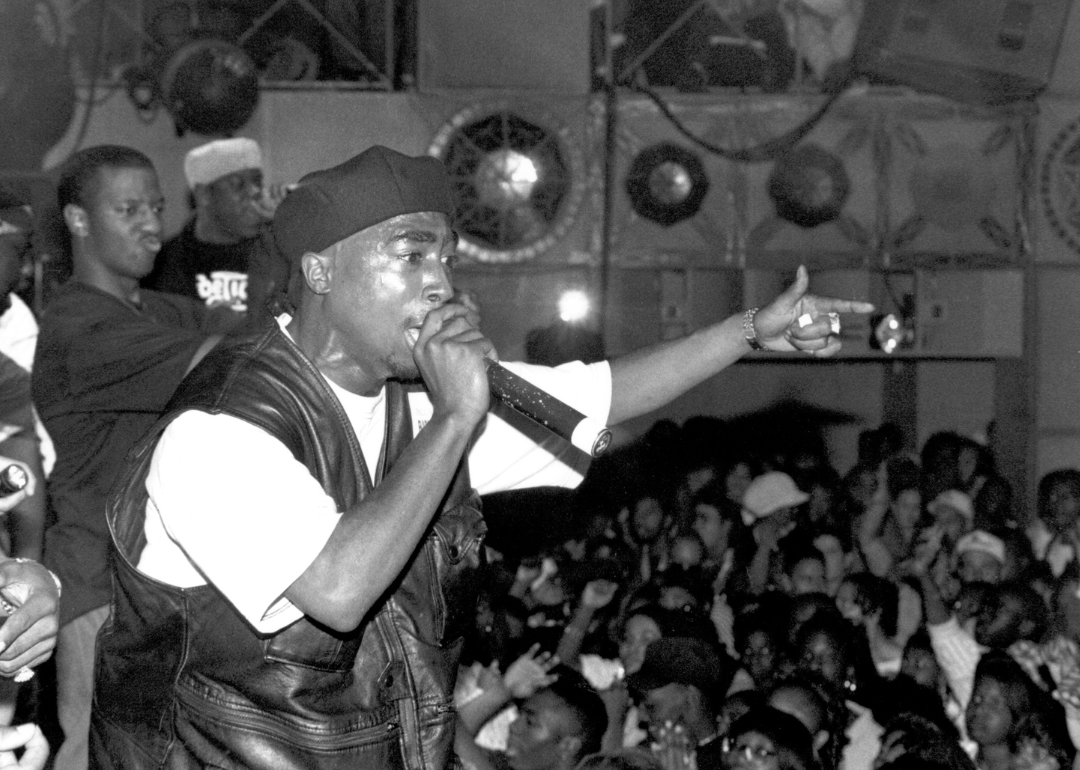 Tupac Shakur performs onstage.