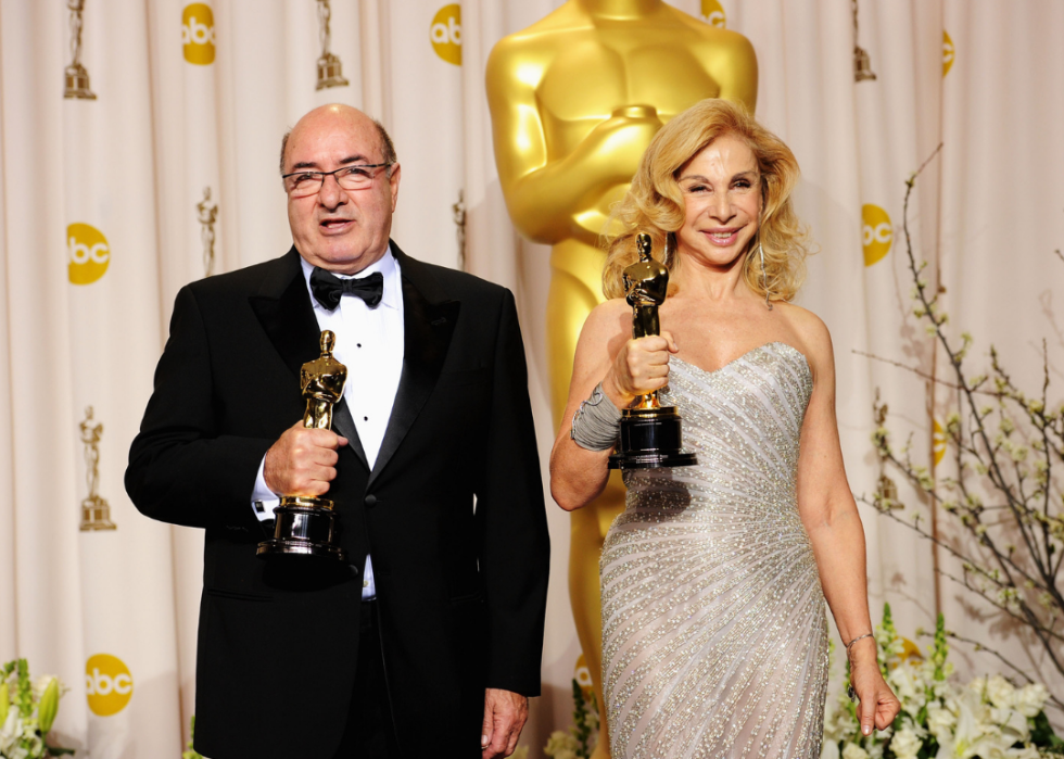 Francesca Lo Schiavo and Dante Ferretti pose with their Oscars