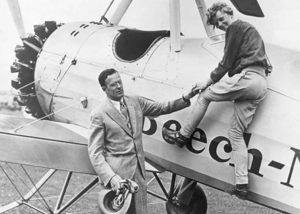 Amelia Earhart with David Palmer Putnam and plane