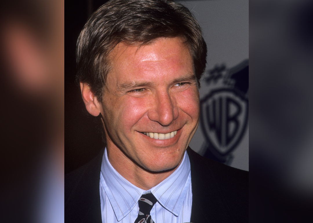 Harrison Ford smiles at an event