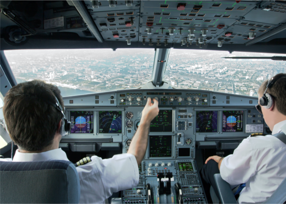 Commercial pilots in an airplane cockpit.