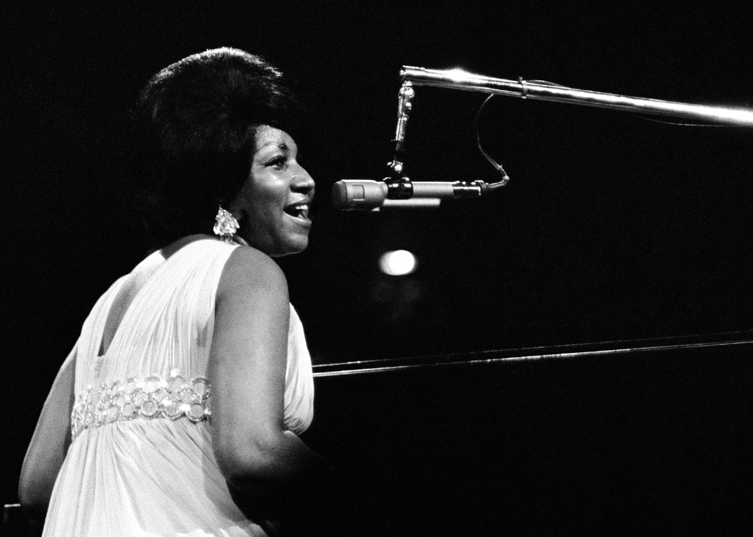 Aretha Franklin plays piano as she performs on stage during the 'Soul Together' Concert.