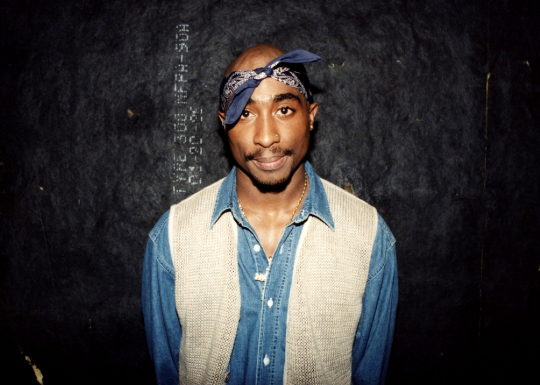 Tupac Shakur poses for a photo backstage.
