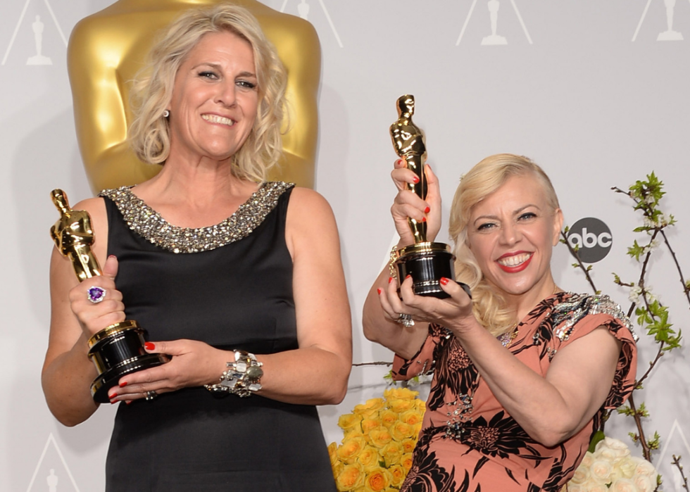 Beverley Dunn and Catherine Martin pose with their Oscars
