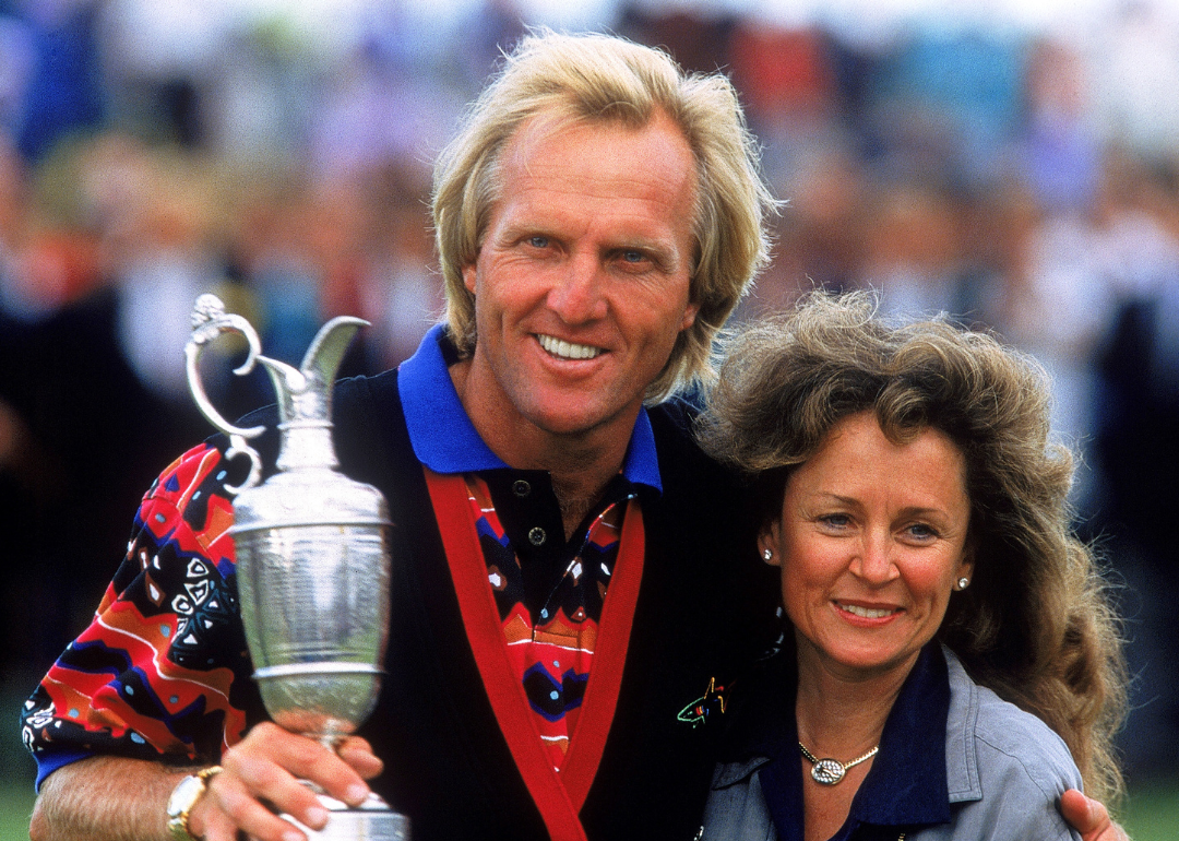 Greg Norman of Australia celebrates with his wife Laura after winning the British Open