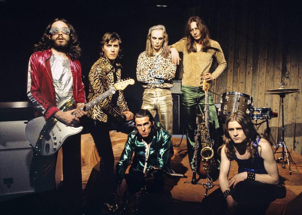 From left to right, Phil Manzanera, Bryan Ferry, Andy Mackay (seated), Brian Eno, Rik Kenton, and Paul Thompson (seated) of Roxy Music pose for a group portrait at the Royal College Of Art video studio in 1972 in London.