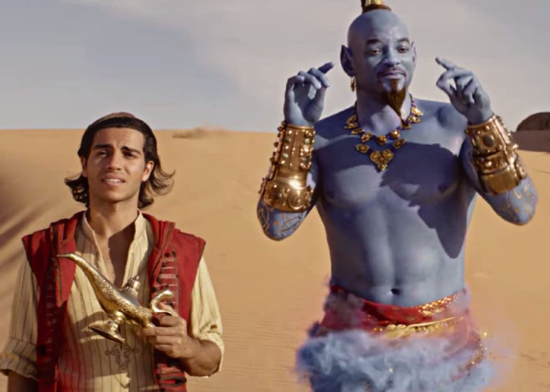 Will Smith, as Aladdin the blue genie, with co-star Mena Massoud.