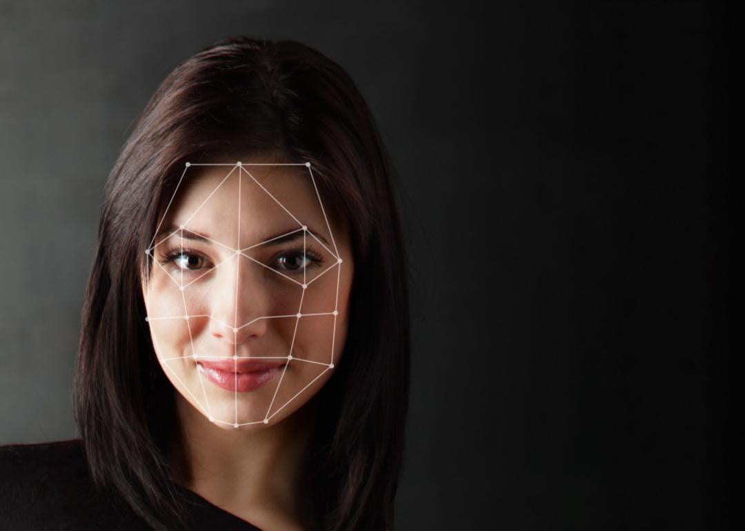 A woman's face is measured by biometric verification.