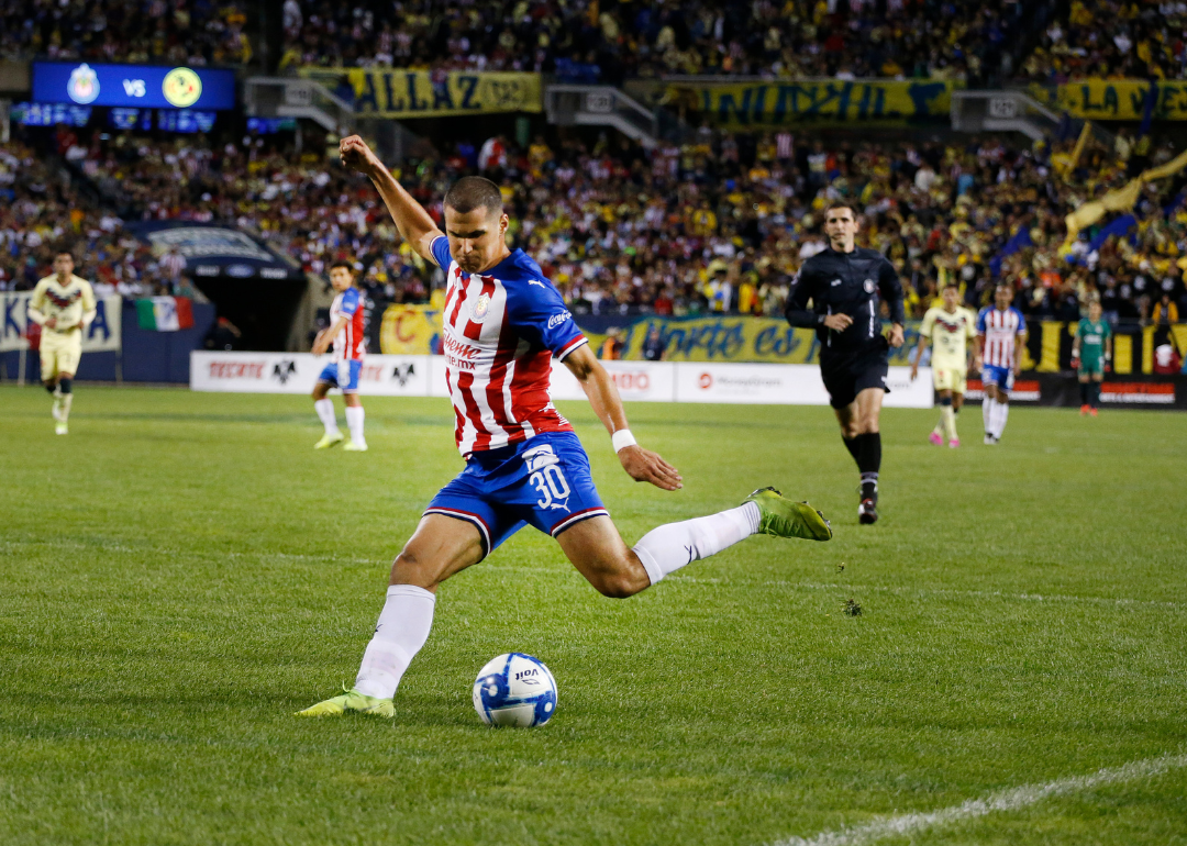 Jose Gonzalez of Chivas de Guadalajara passes the ball during the Super Clasico game against Club America