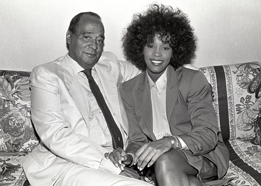 John Houston and Whitney Houston pose for photo.