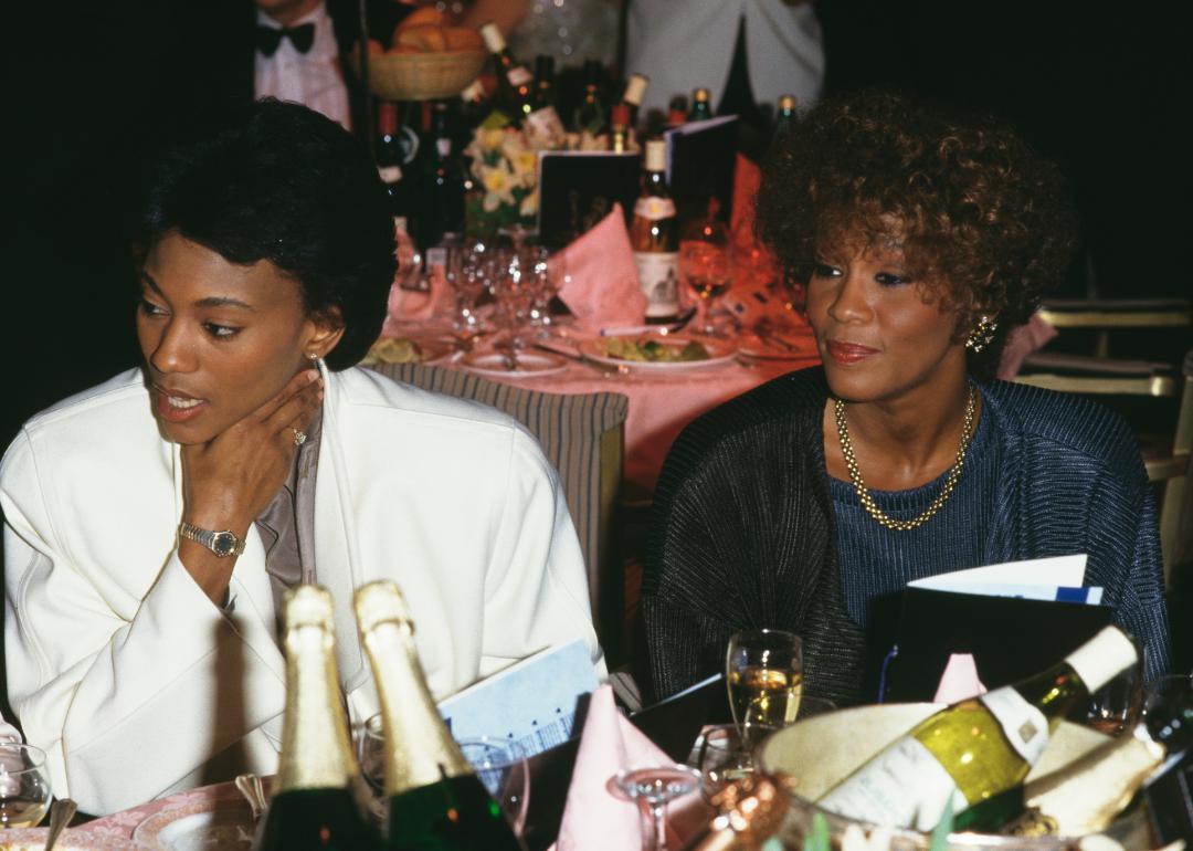 Robyn Crawford and Whitney Houston at event.