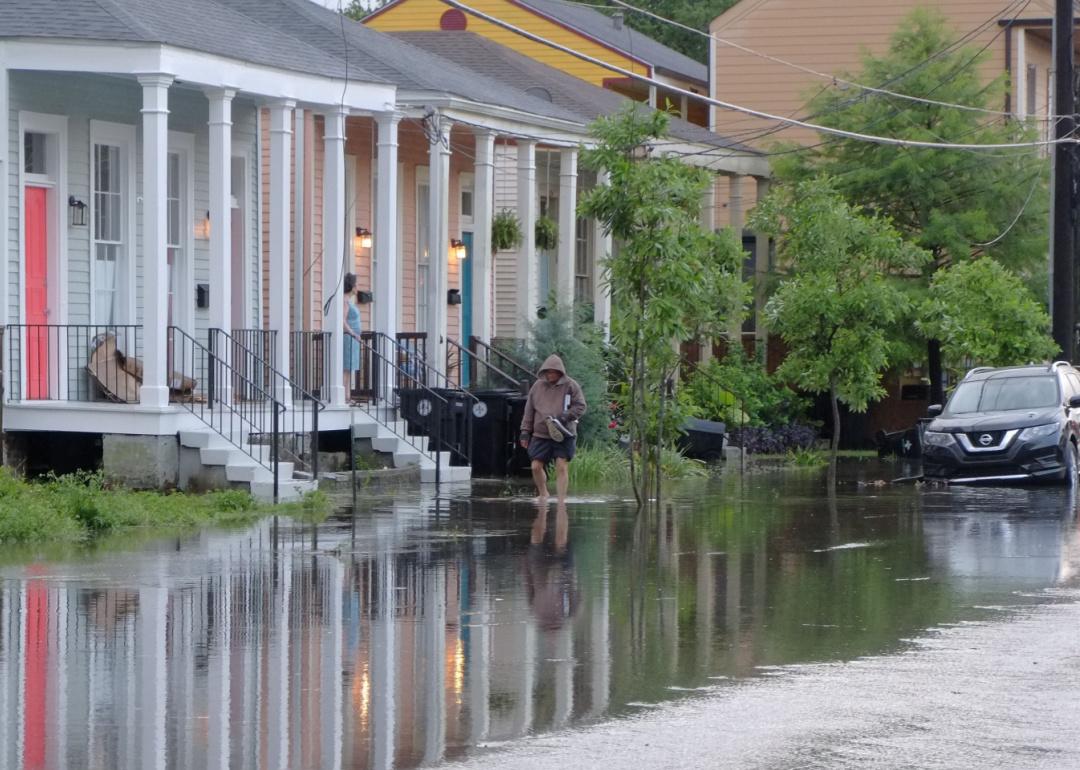 Residents wade through street flooding in Central City New Orleans.