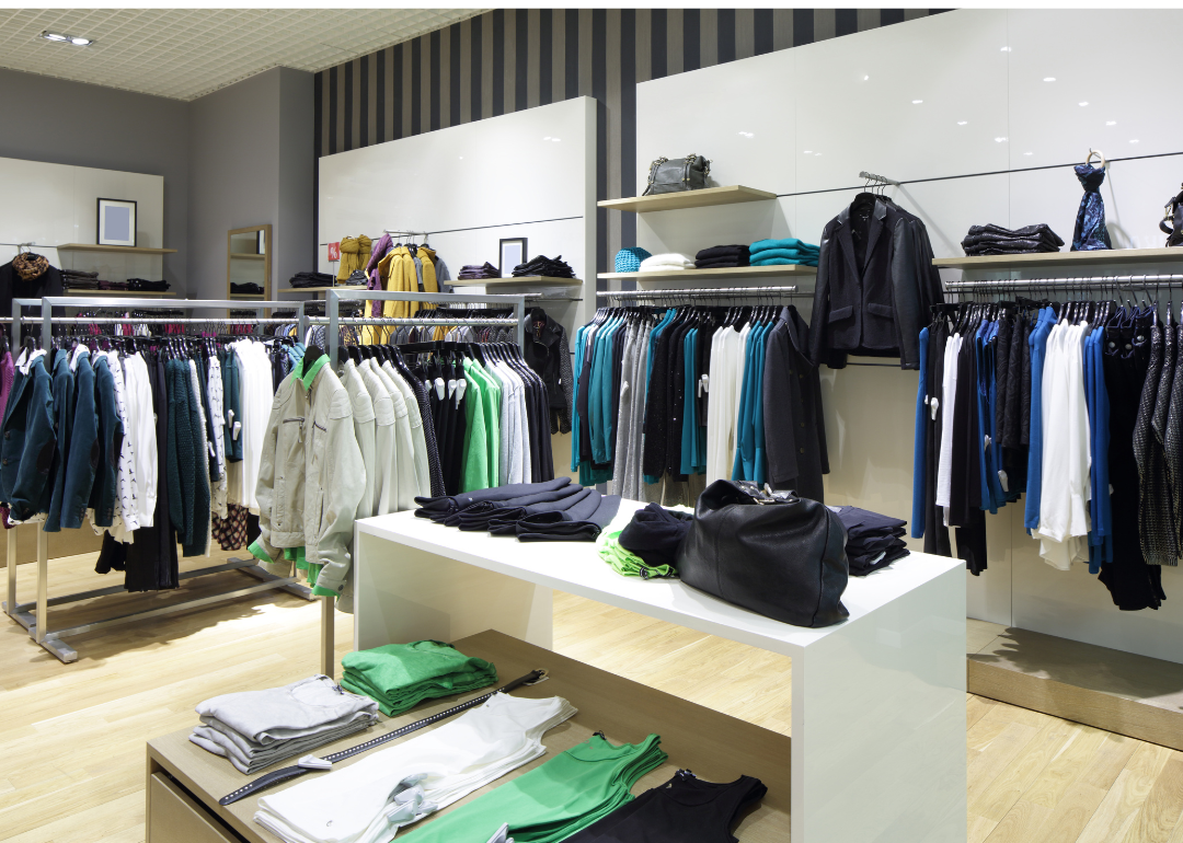 Interior of a clothing store with racks of jackets.