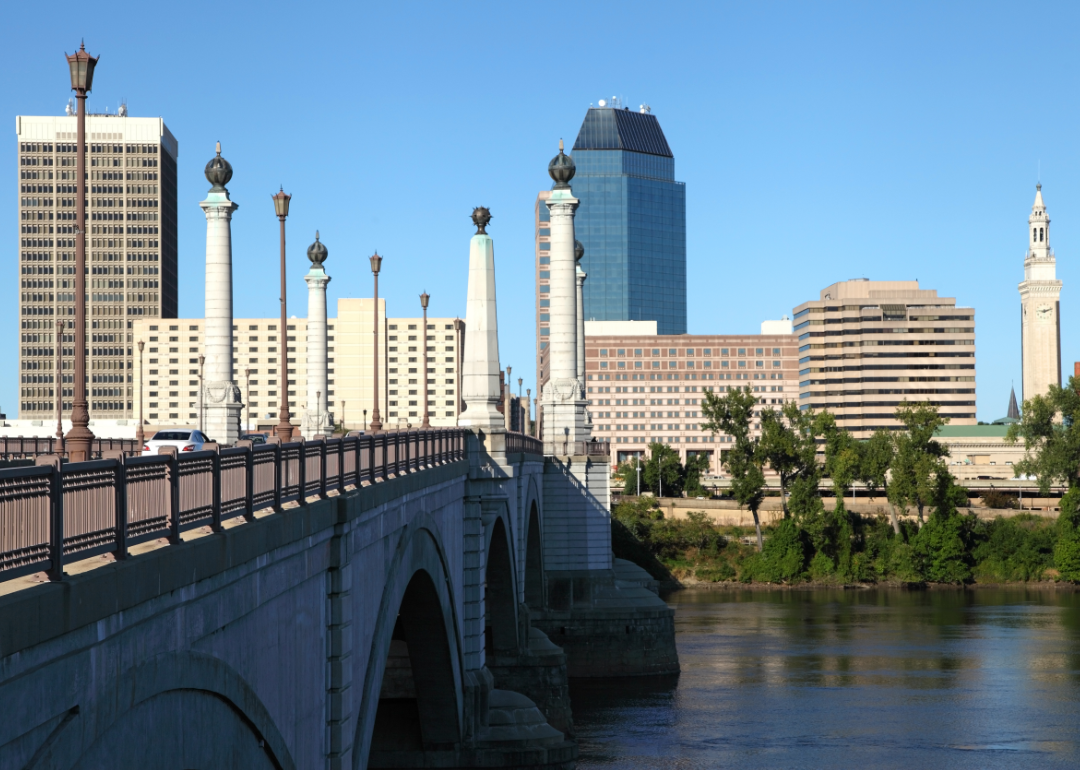 A bridge leads across a river into downtown Springfield, Massachusetts.