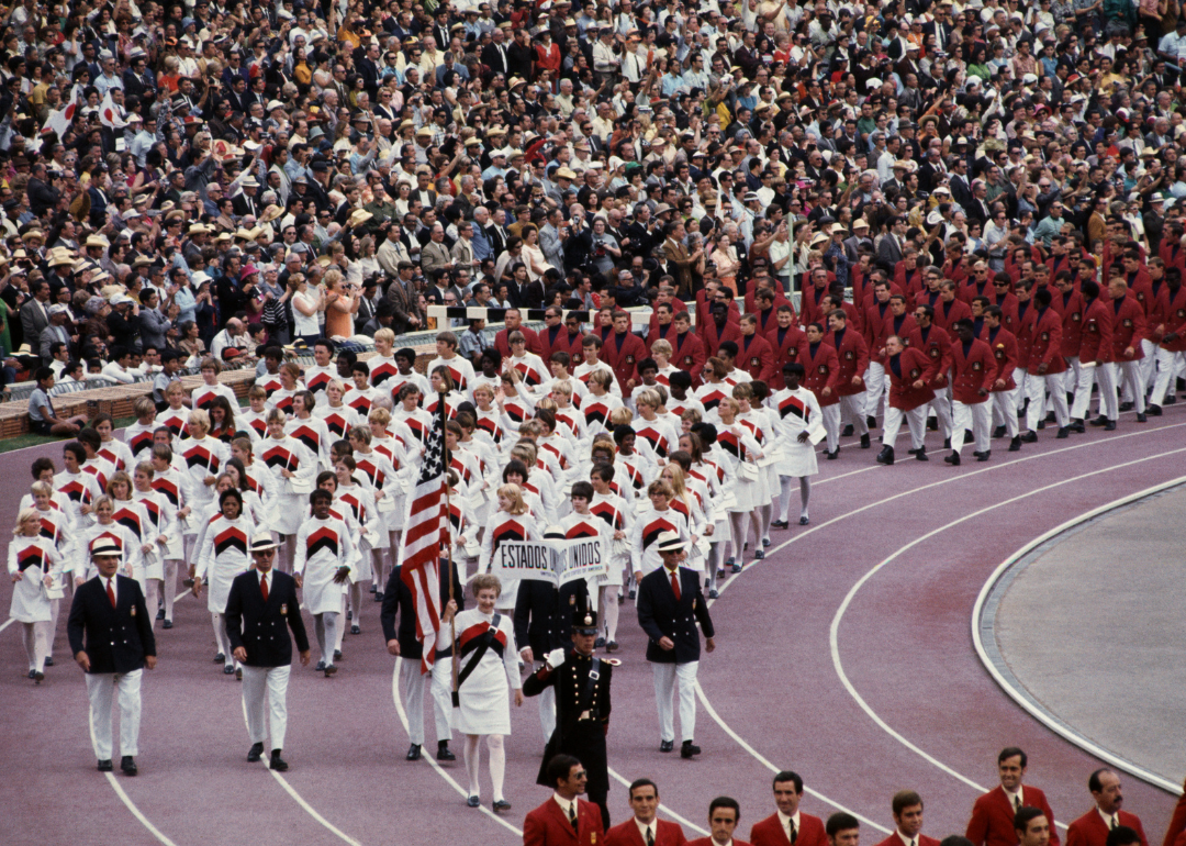 The U.S.A. Olympic team marches into Olympic Stadium during opening ceremonies of the 1968 Olympics.