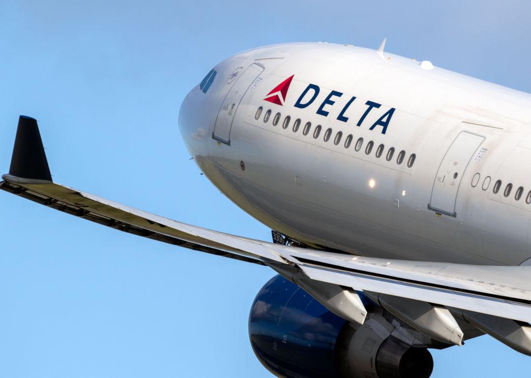 A delta airlines jet takes off.