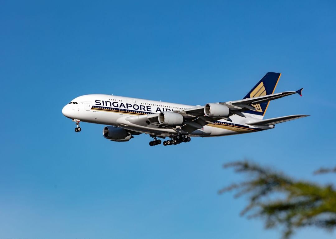 A Singapore Airlines jet descending to land.