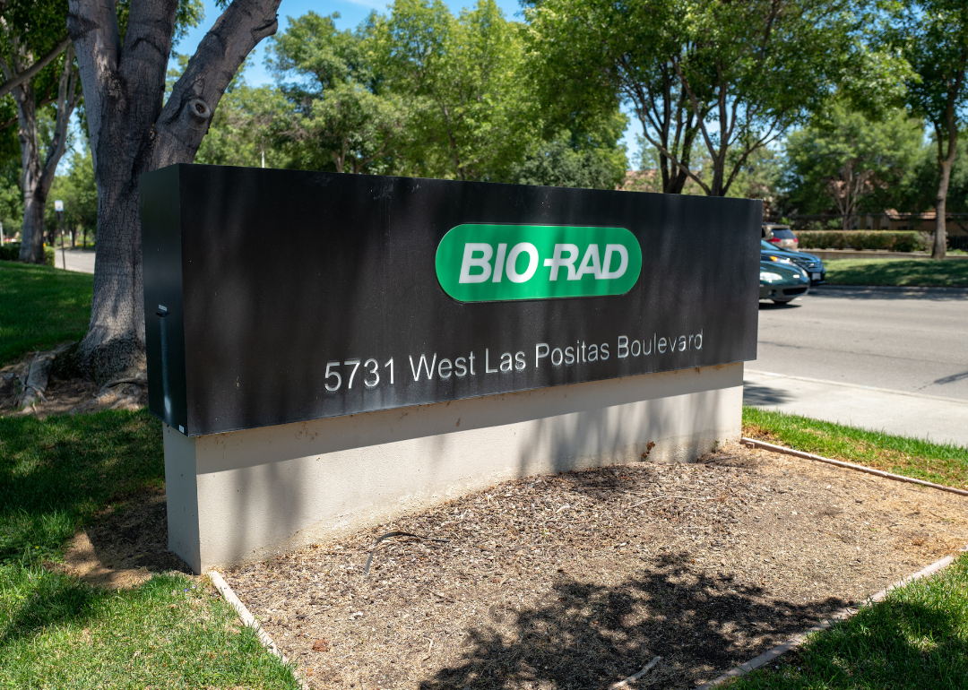 Sign with logo at entrance to office of life sciences supply company Bio-Rad in Pleasanton, California.