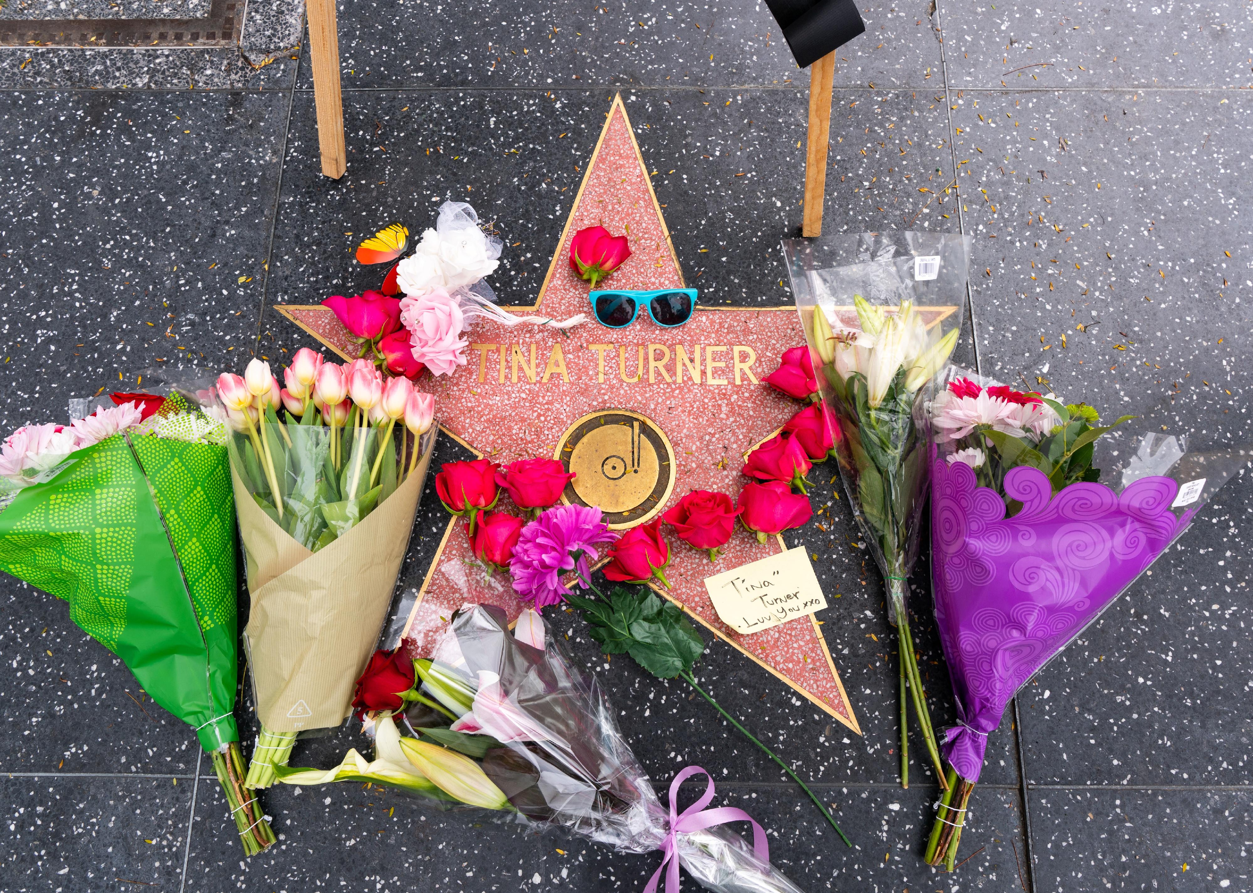 Flowers and memorabilia at Tina Turner's star on the Walk of Fame.