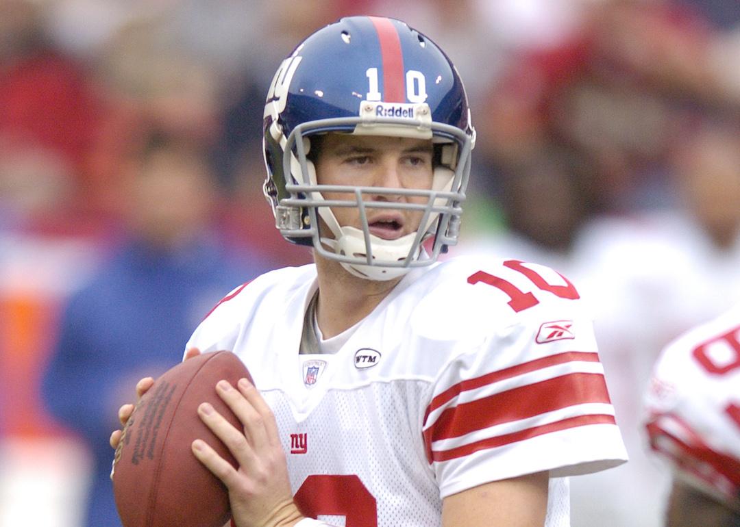 Eli Manning of the New York Giants drops back to pass against the San Francisco 49ers during an NFL football game.