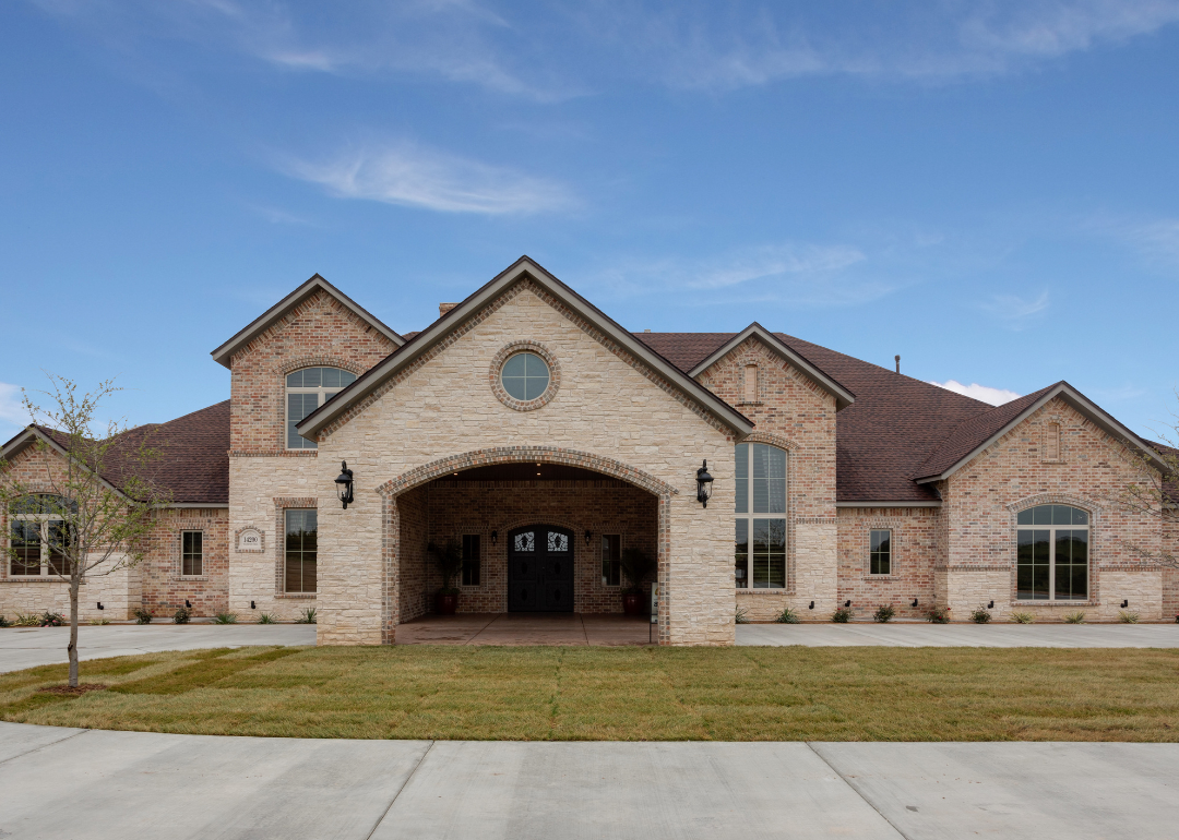 An exterior of large mansion in suburban Texas.