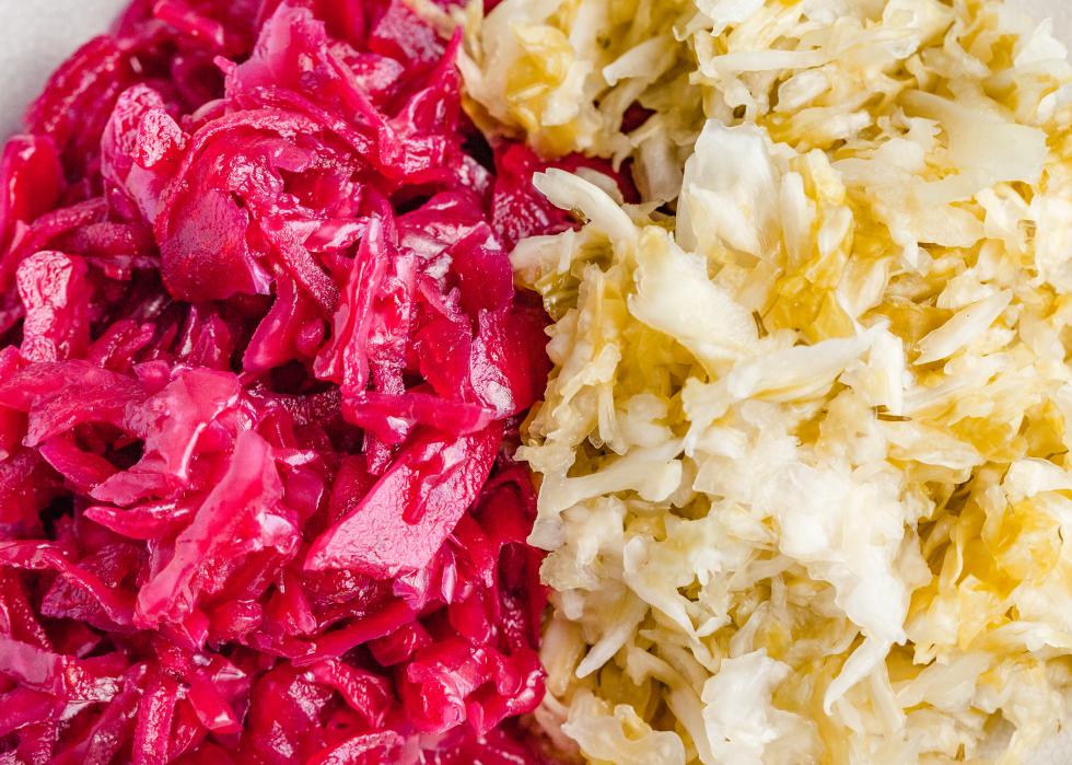 Side by side view of red and white sauerkraut.