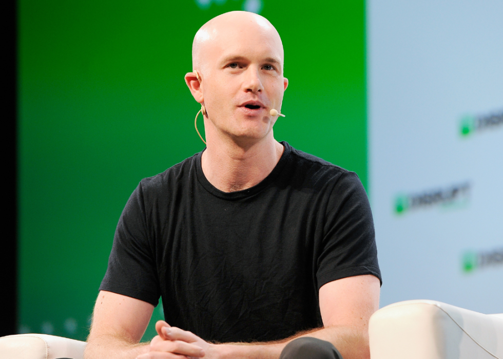 Brian Armstrong speaks onstage during a TechCrunch Disrupt event.