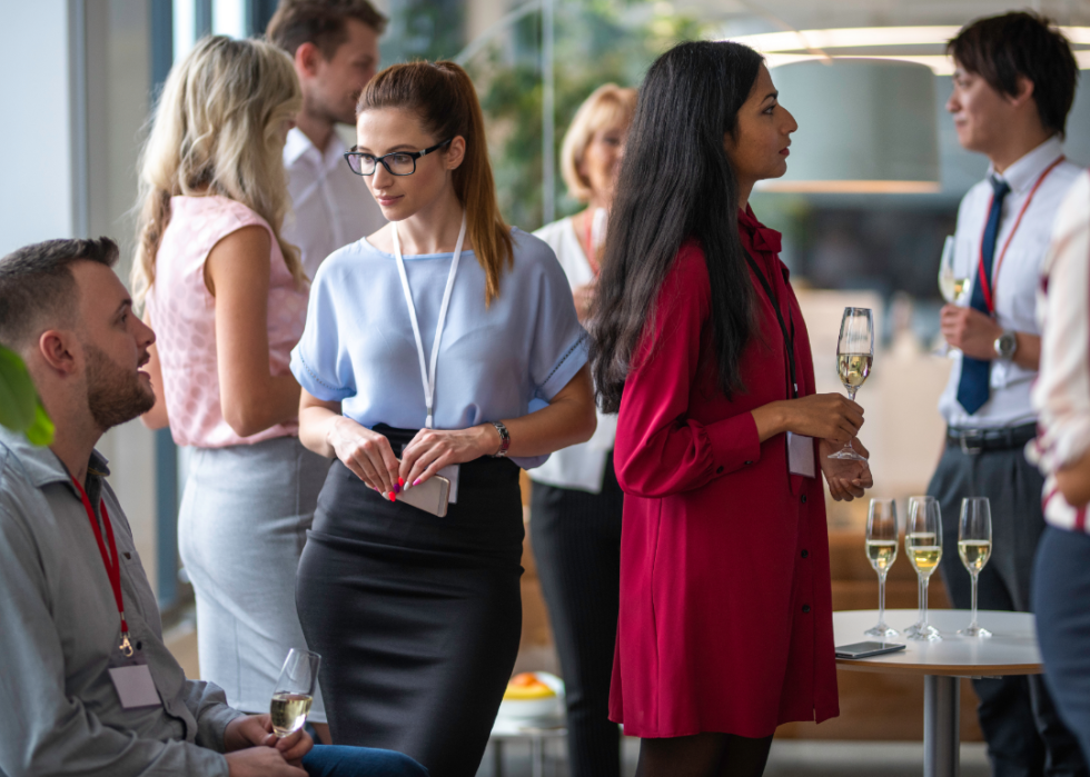 Business people interact at a casual networking event.