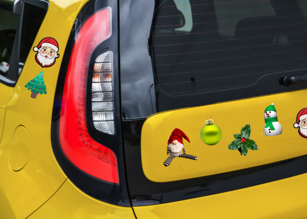 Christmas car magnets on a yellow Kia Soul