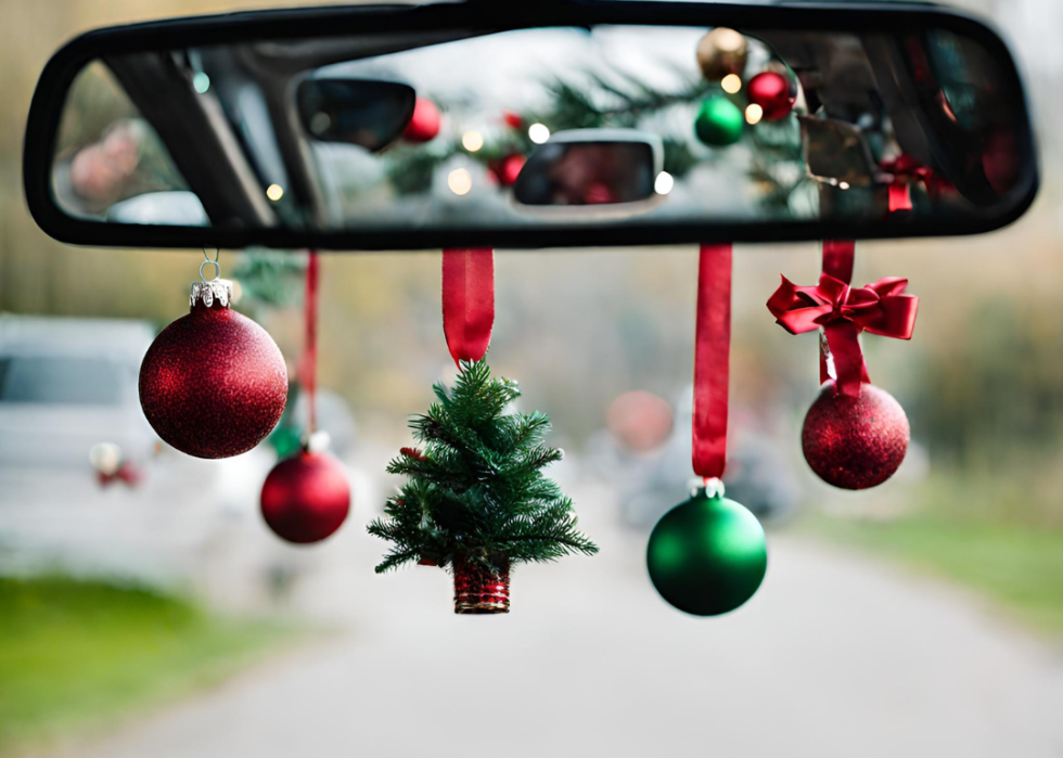 Holiday bangles hanging from the rearview mirror of a car