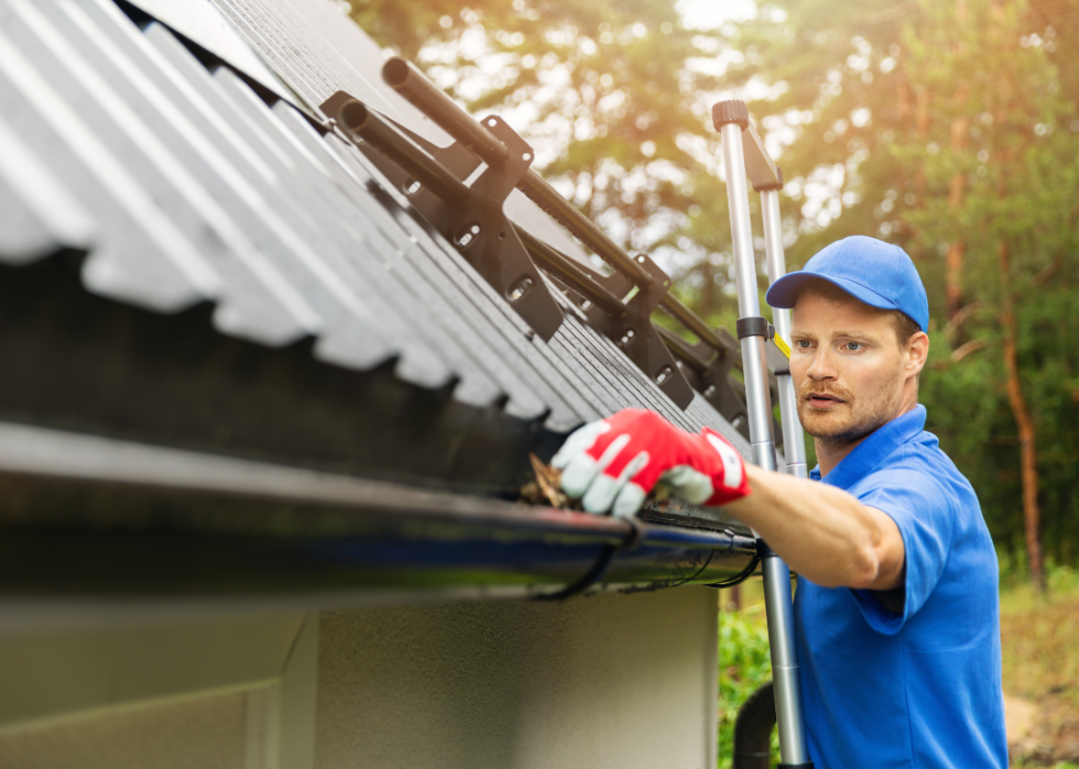 A gutter cleaner cleaning gutters