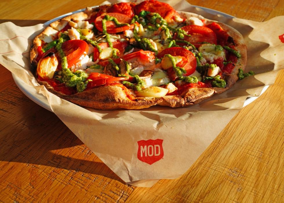 An individual pizza on a wood table at MOD Pizza restaurant in Pocatello, Idaho.