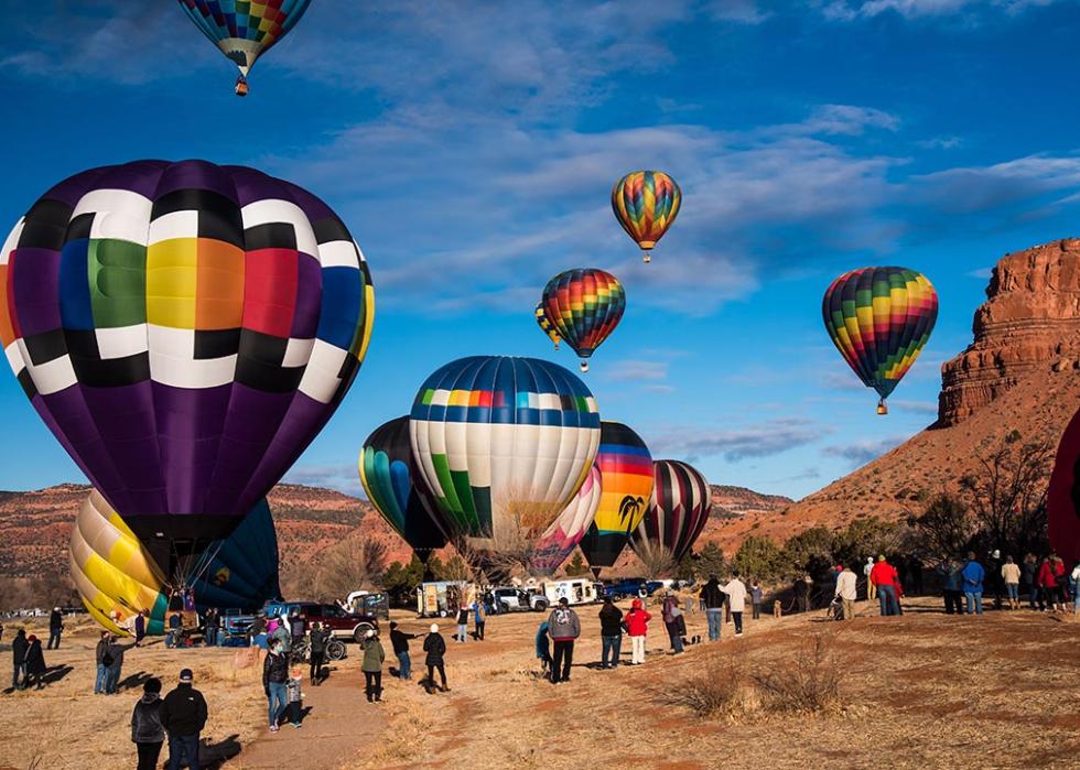 Spectators gather in open fields at the 'Balloons and Tunes' Festival in Kanab, UT