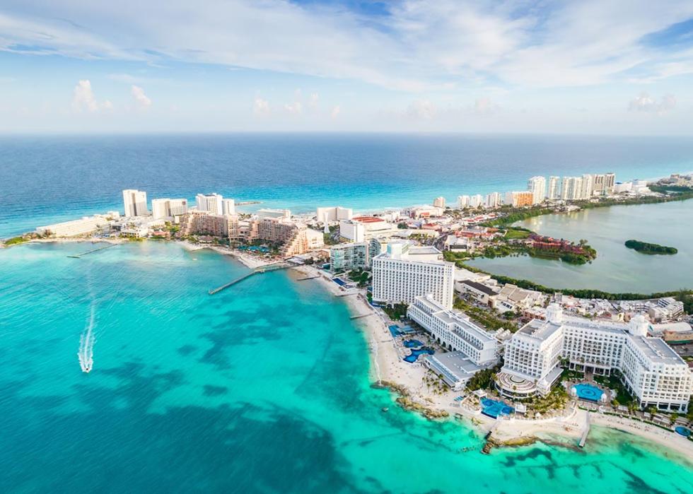 Aerial view of Cancun resort area with blue green ocean.