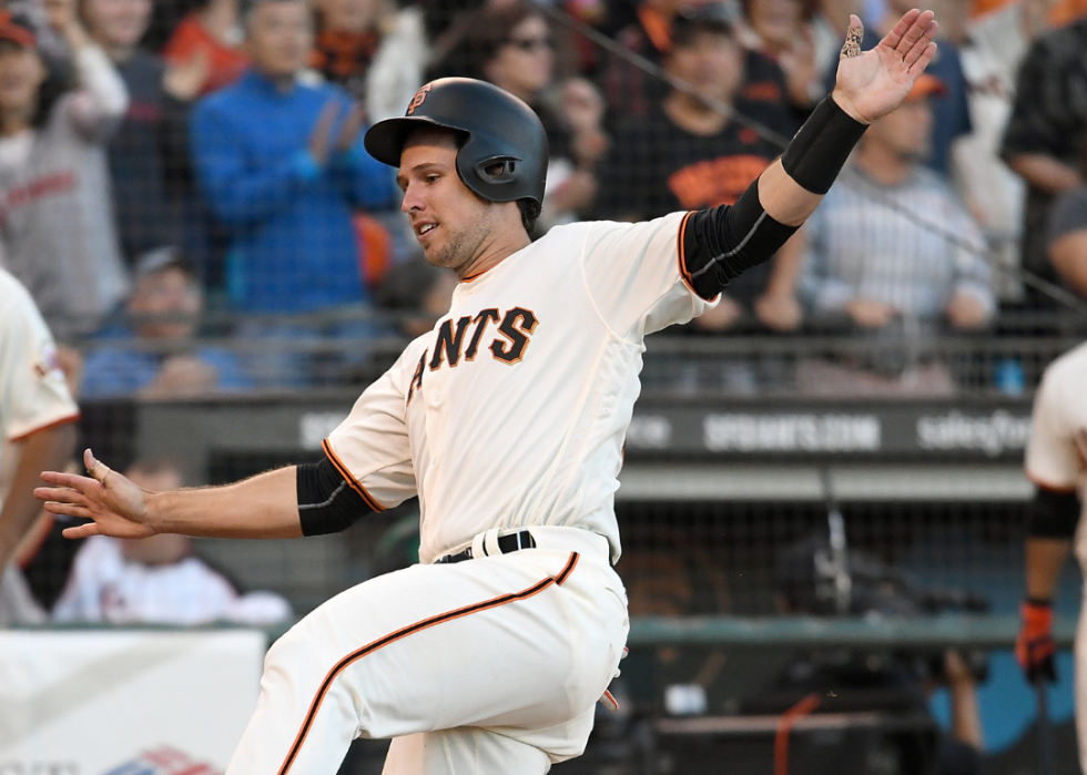 Buster Posey #28 of the San Francisco Giants scores against the Arizona Diamondbacks in the bottom of the seventh inning at AT&T Park on July 10, 2016 in San Francisco, California.