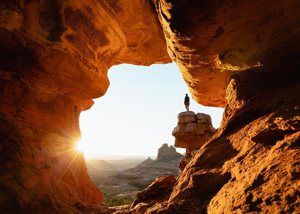 Dramatic viewpoint at Merry-go-round Rock in Sedona Arizona at sunset with sun flare.