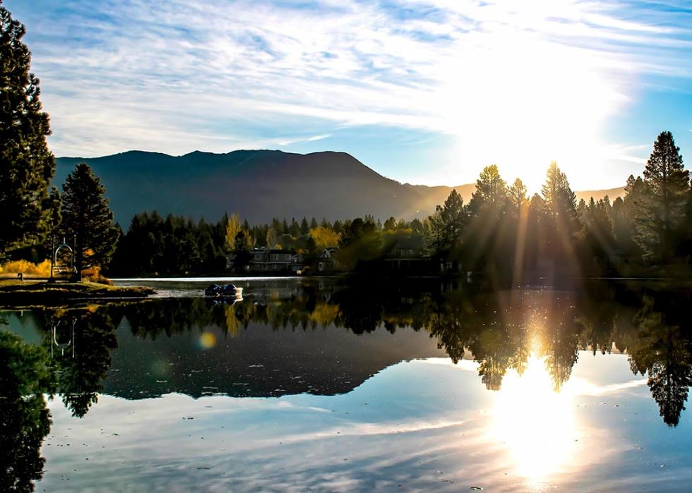 Morning sunrise along Tahoe keys lake with reflecting mountain range in South Lake Tahoe, CA