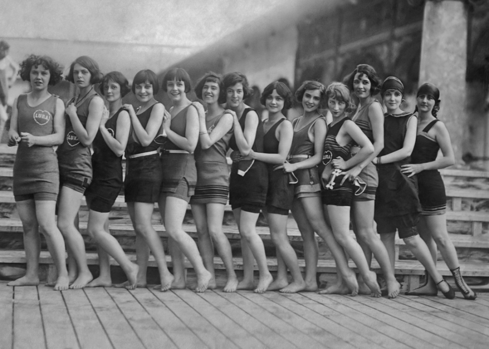 A group of women in bathing suits line up at the Luna Park boardwalk in Coney Island in 1923. 